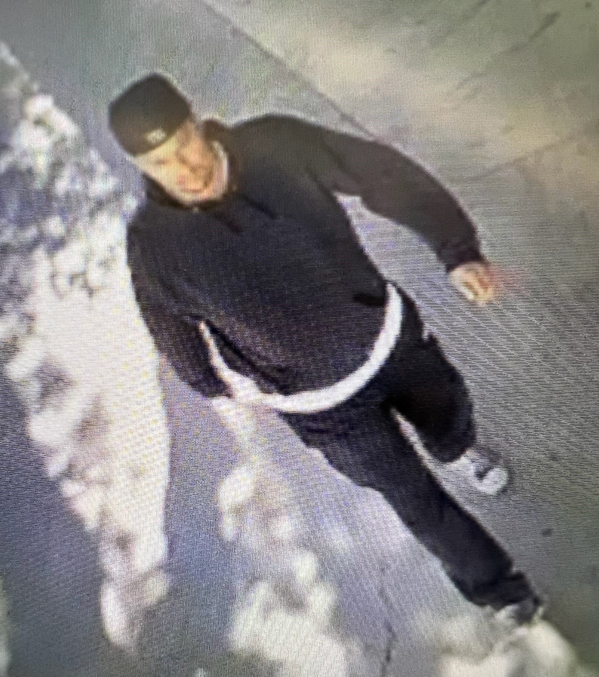 The subject is described as a Caucasian or Hispanic male adult who stands approximately 5’8” with a medium build and dark hair. At the time of the robbery, the subject had a goatee and wore a black baseball cap, black hooded sweatshirt, white undershirt, black pants, and Converse-style black and white tennis shoes.